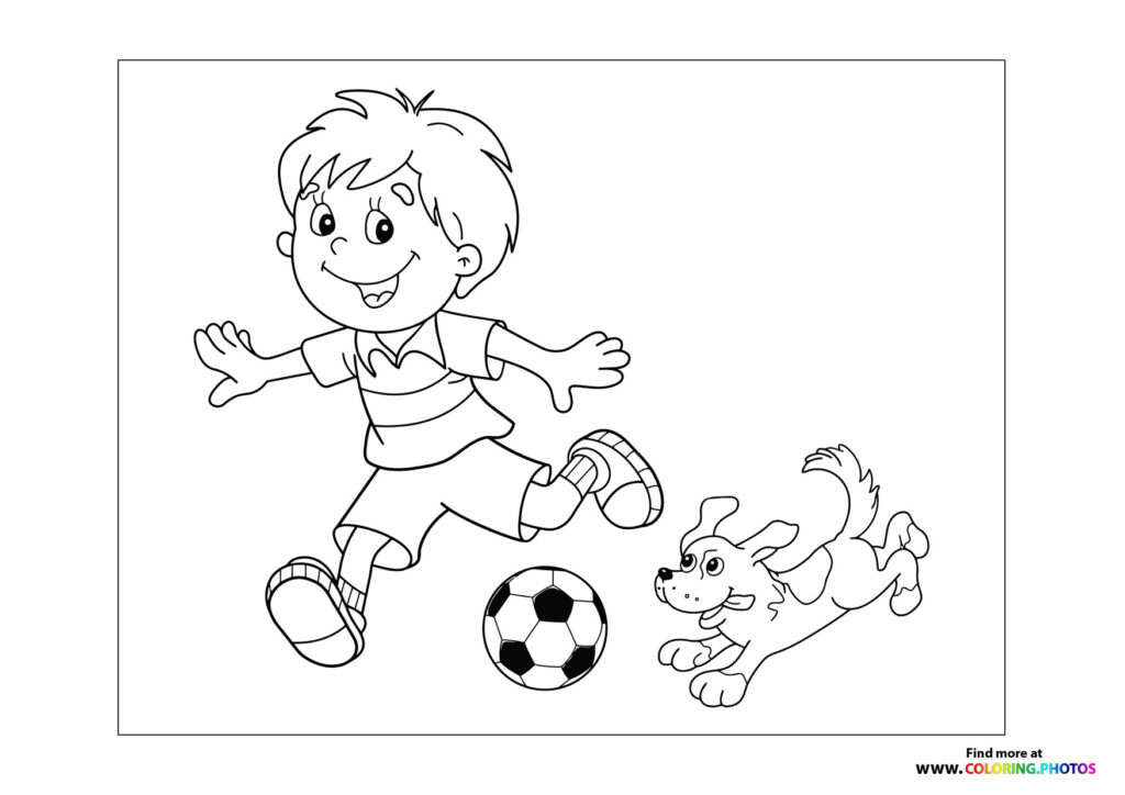 Boy and dog playing football