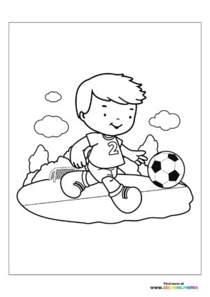 Boy kicking soccer ball