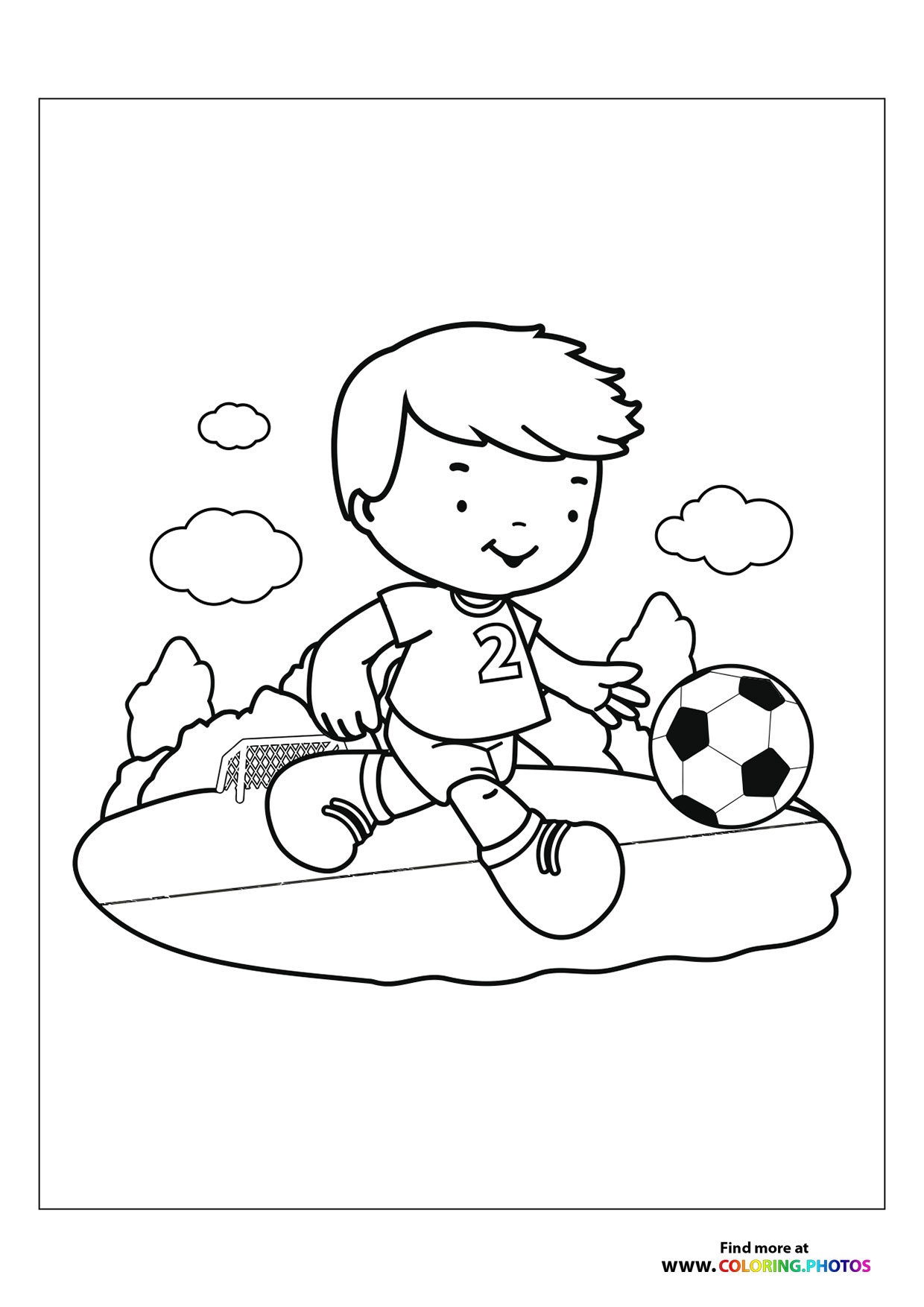 Boy kicking soccer ball