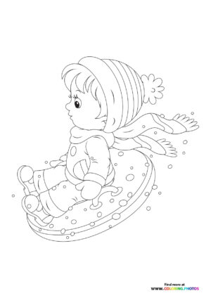 Boy snow tubing