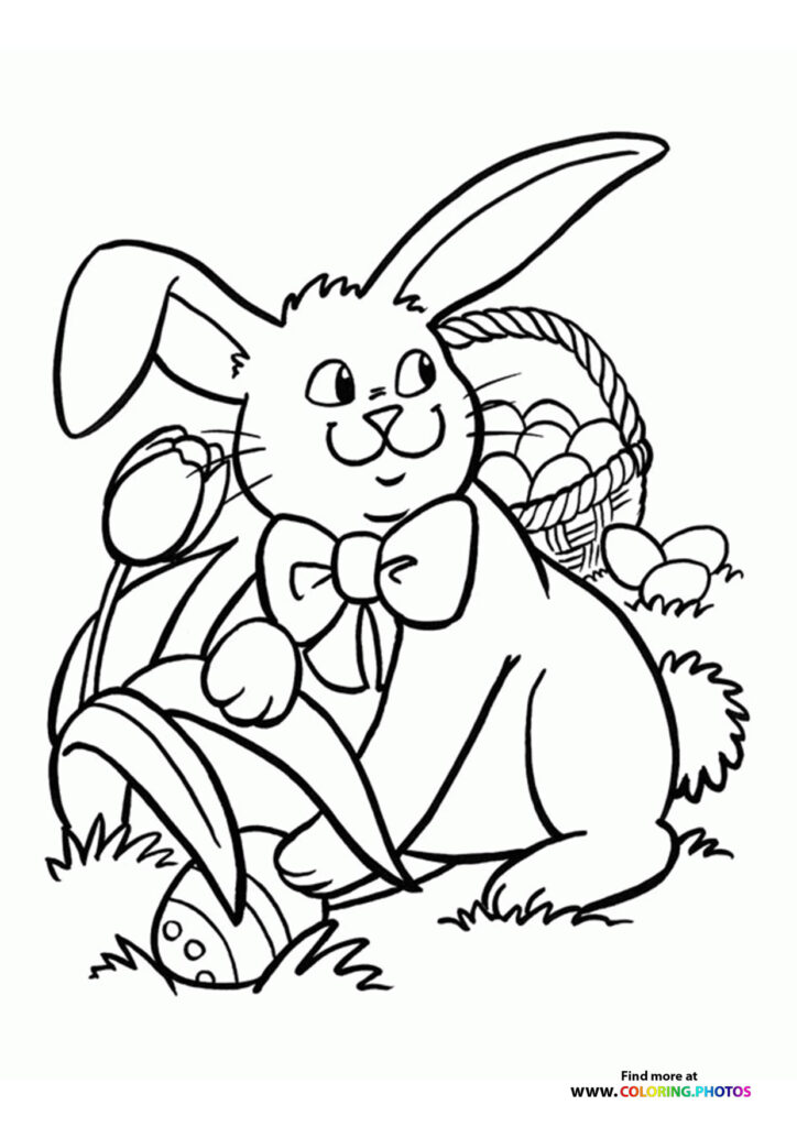 Easter bunny hiding eggs coloring page