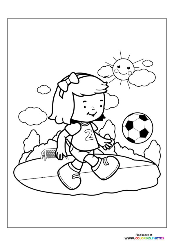 Girl kicking soccer ball