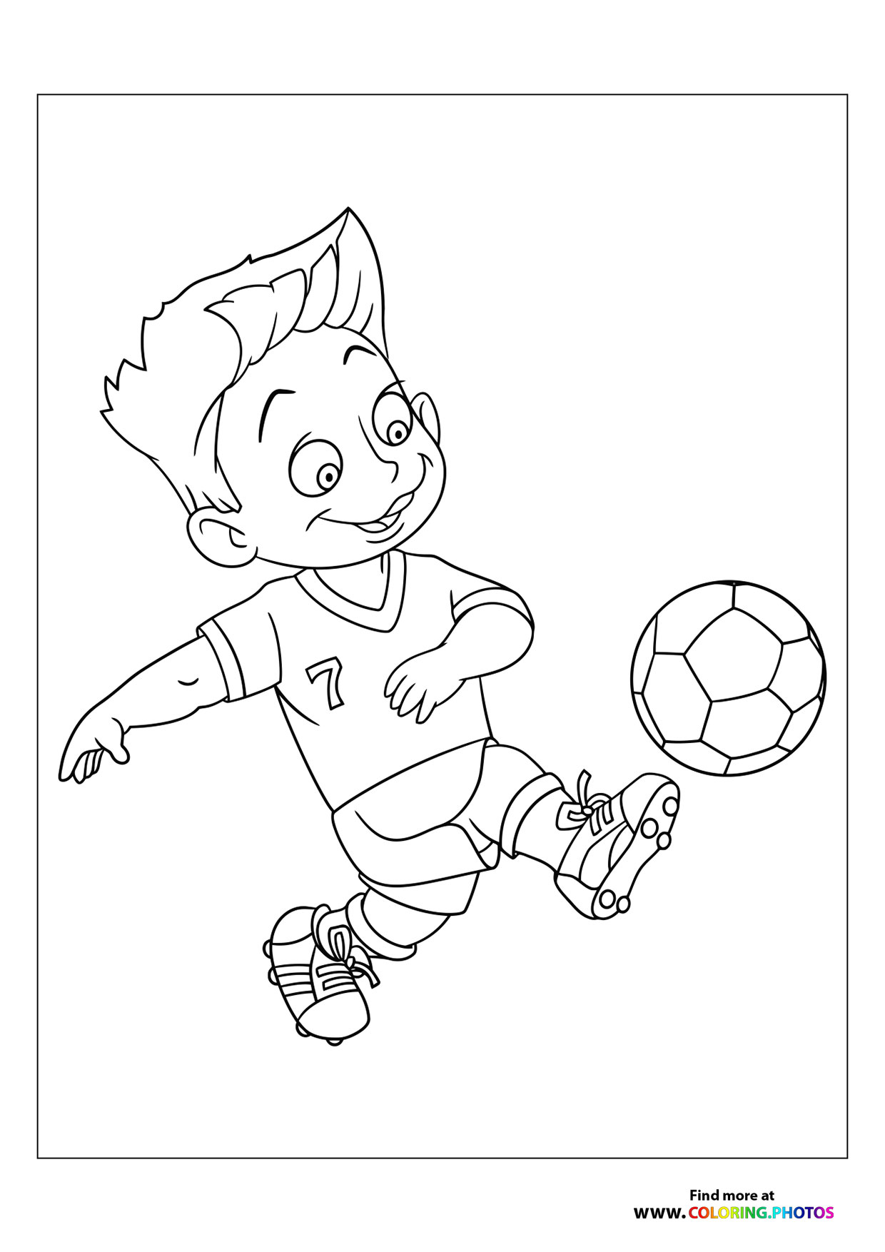 Little boy kicking the football
