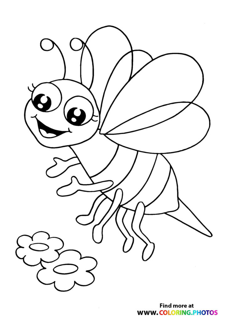 Bee flying to a flower